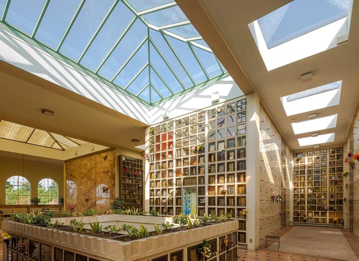 Interior view of the Chapel of the Chimes with glass ceiling and columbarium walls.