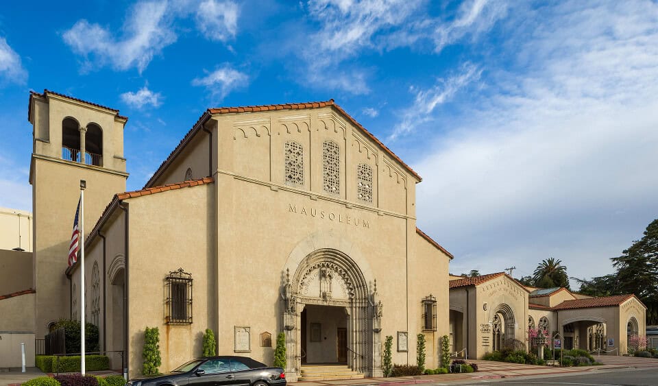 Exterior view of the Chapel of the Chimes with a clear blue sky.