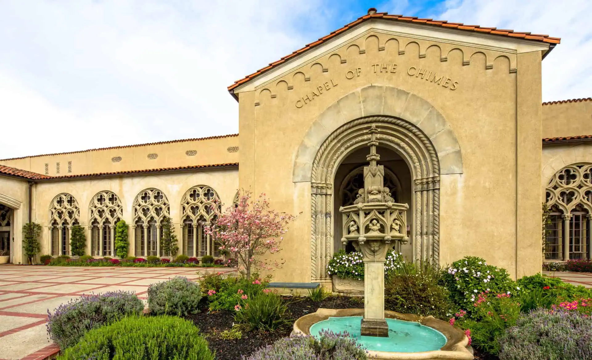 Exterior view of Chapel of the Chimes Oakland with fountain and garden.